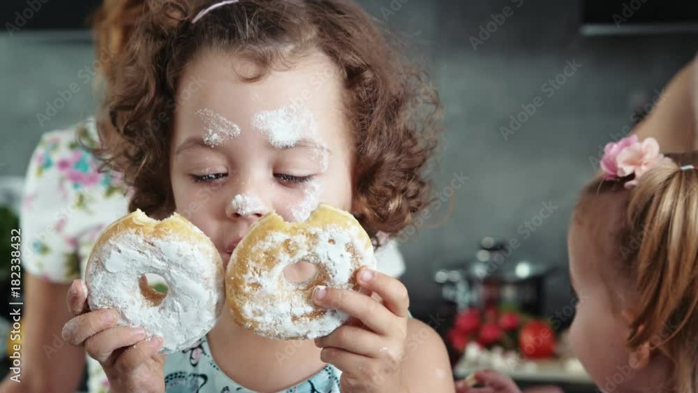 Charming women baking with joyful children Charming women baking with joyful children