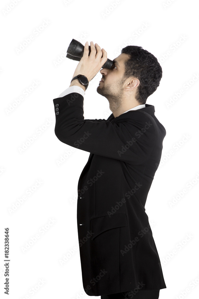 Young manager seeing through binoculars Young manager seeing through binoculars