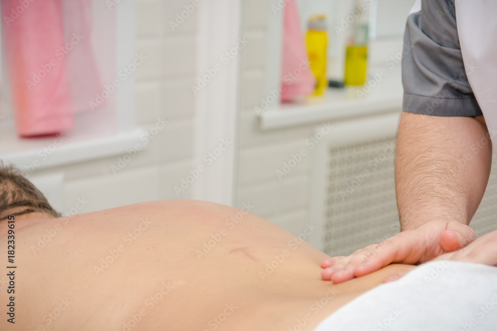 Men's massage. The man does massage. Massage by hands. Men's massage. The man does massage. Massage by hands.