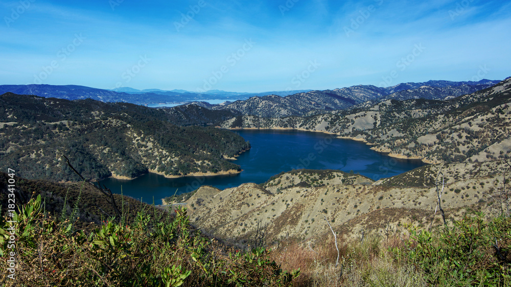 Aerial view of Lake Berryessa from the Blue Ridge Trail, Stebbins Cold Canyon, on a sunny day, featuring the surrounding blue oak woodland after the 2015 wragg fire
