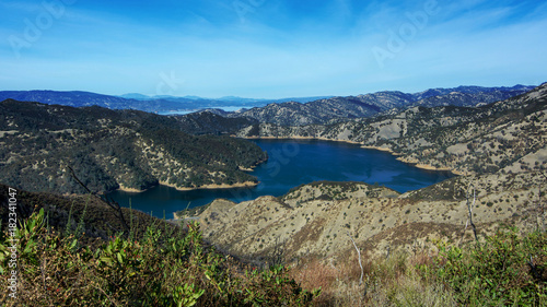 Aerial view of Lake Berryessa from the Blue Ridge Trail, Stebbins Cold Canyon, on a sunny day, featuring the surrounding blue oak woodland after the 2015 wragg fire