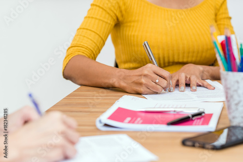 Closeup Asian Businesswoman hand writing in modern Office, People business concept