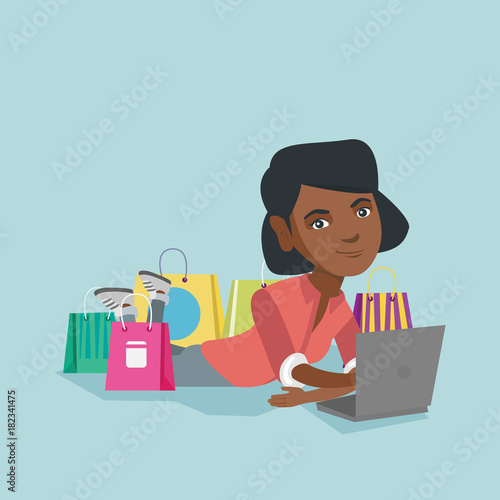 Young african-american woman using a laptop for online shopping
