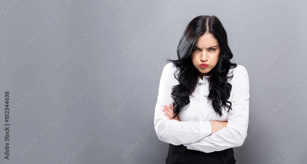 Unhappy young woman on a solid background Unhappy young woman on a solid background