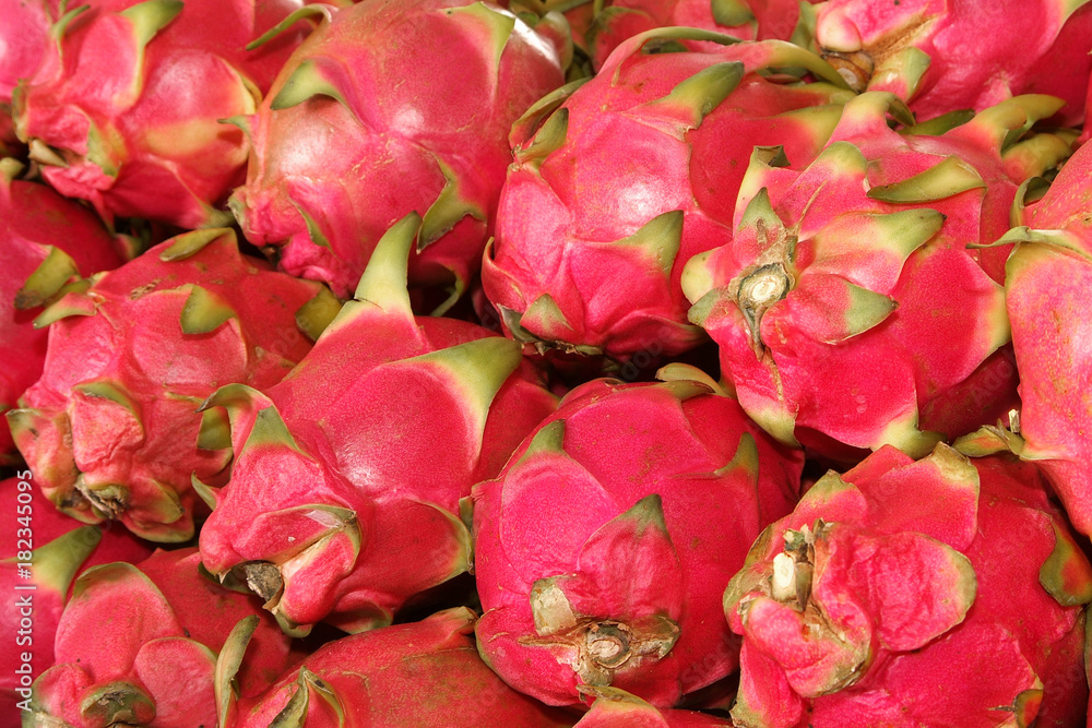 Pile of dragon fruits for sale at market