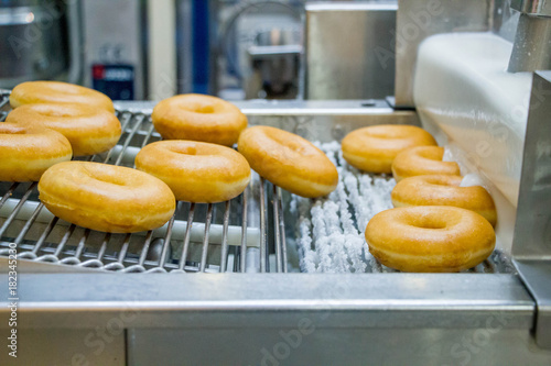 dough nuts on conveyor belt