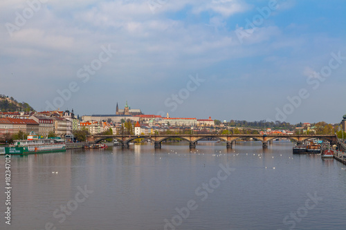 View of Vltava river in Prague and Charles bridge and the Castle, Czech Republic