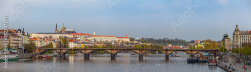 Wide panoramic view of Vltava river in Prague and Charles bridge and the Castle, Czech Republic © yegorov_nick