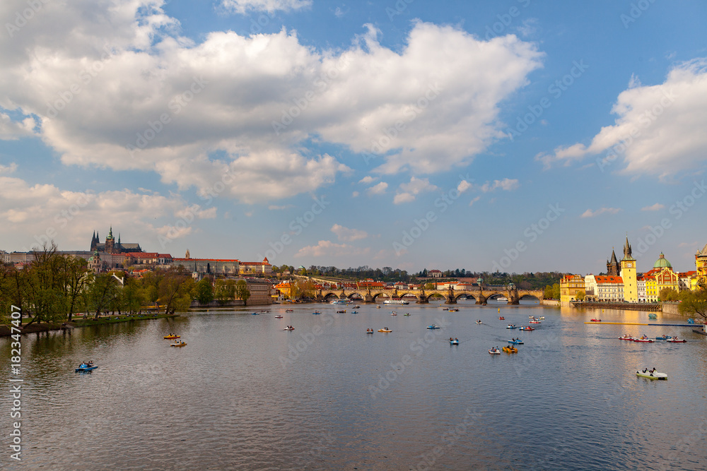 Obraz premium View on the river Vltava with boats. Old town of Prague, Czech Republic, summer season.