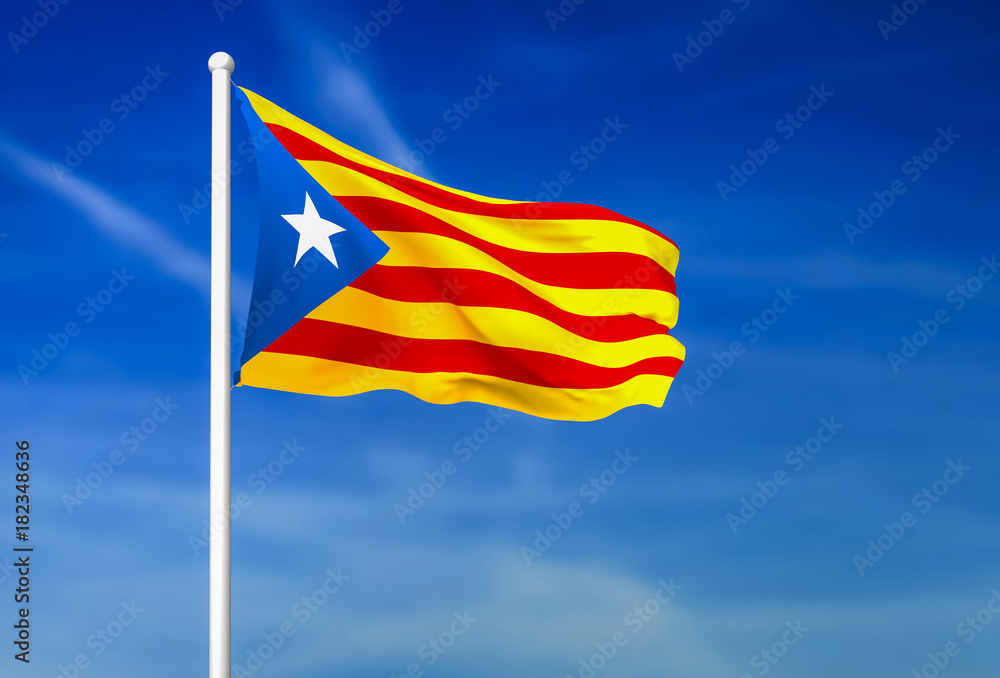 Waving flag of Catalonia on the blue sky background
