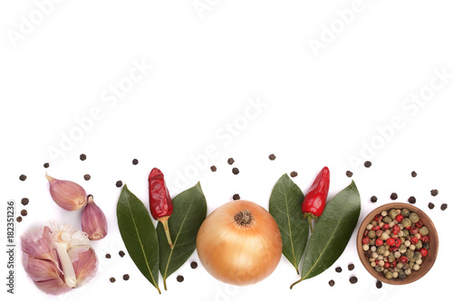 mix of onion, garlic, hot pepper, peppercorn and laurel leaf isolated on white background with copy space for your text