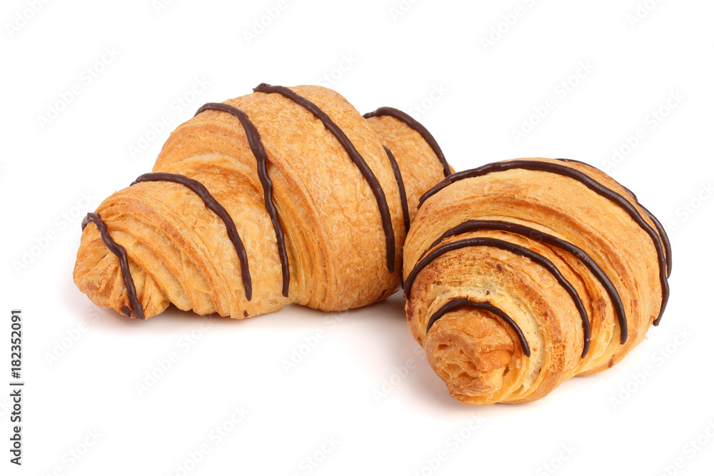 croissant decorated with chocolate sauce isolated on white background, top view