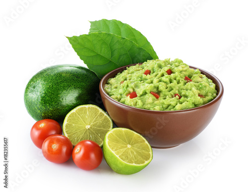Guacamole and ingredients isolated on white background.