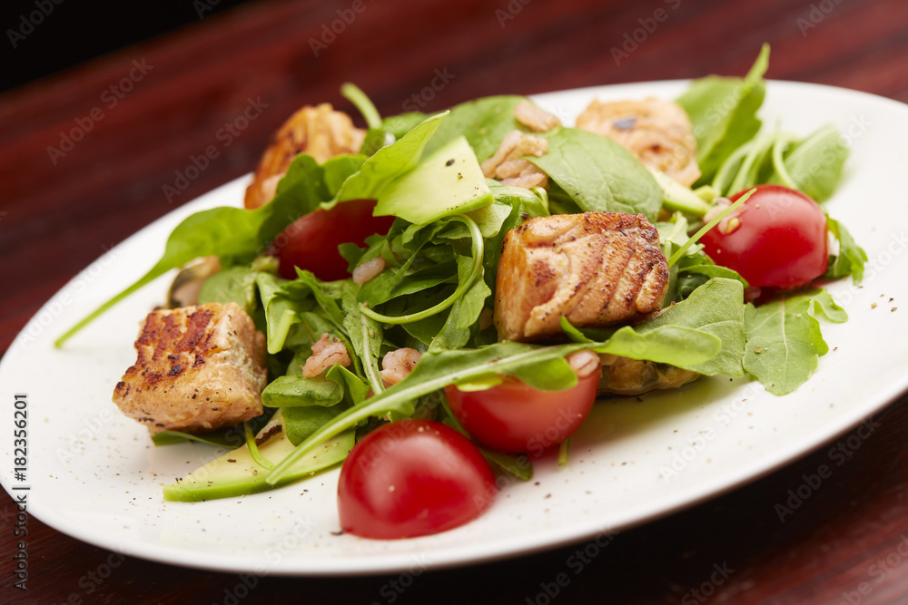 Salad with fish, arugula, cherry tomatoes Salad with fish, arugula, cherry tomatoes