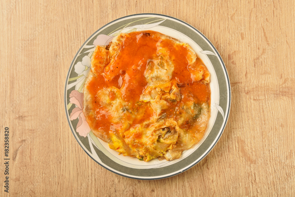 Oyster omelet,famous snack food at night market in Taiwan. Oyster omelet,famous snack food at night market in Taiwan.
