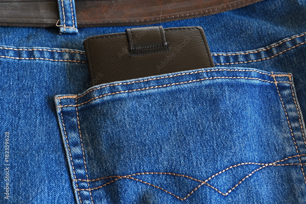 black leather wallet sticking out of jeans pocket black leather wallet sticking out of jeans pocket