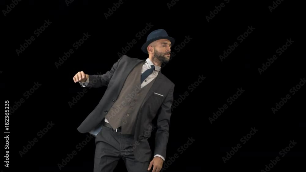 a skillful male dancer in a smart suit dancing in a contemporary style a skillful male dancer in a smart suit dancing in a contemporary style