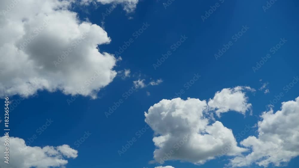 Clouds are moving in the blue sky. TimeLapse. Beautiful White fluffy