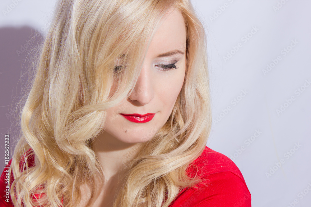 Fashion portrait of sexual blond woman with provocative glossy red lips Fashion portrait of sexual blond woman with provocative glossy red lips