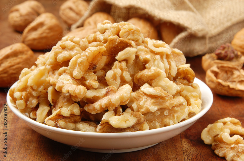 Walnut kernel in a white bowl Walnut kernel in a white bowl