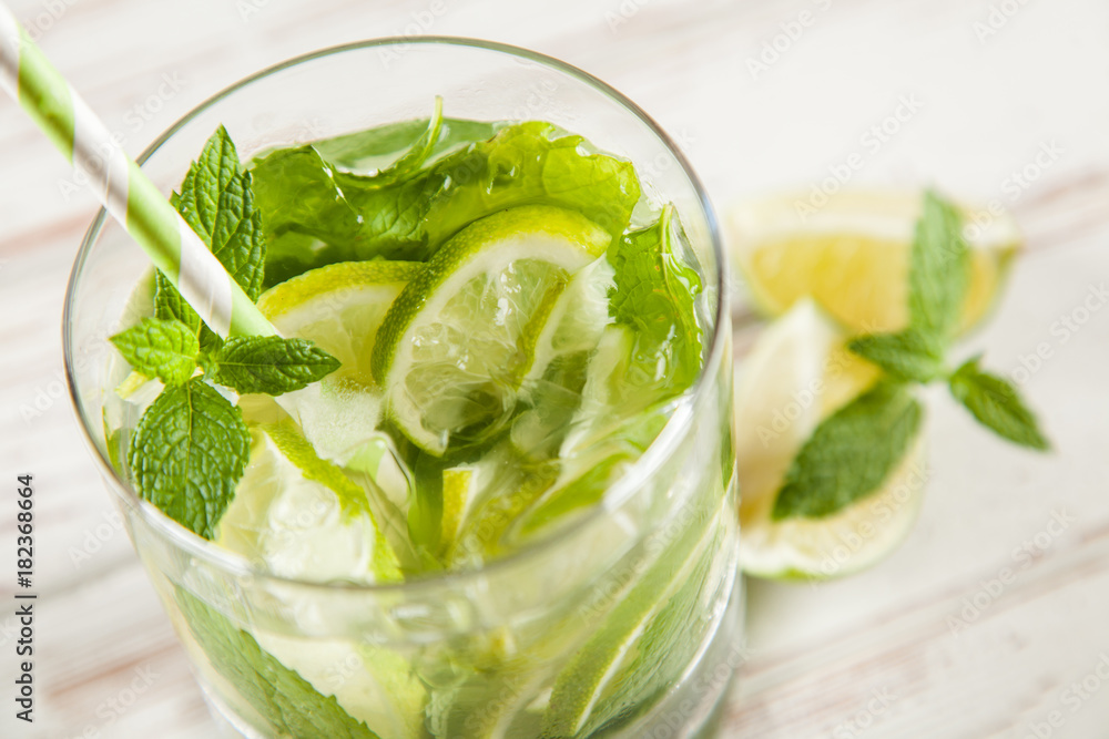 Mojito cocktail on white wood background Mojito cocktail on white wood background