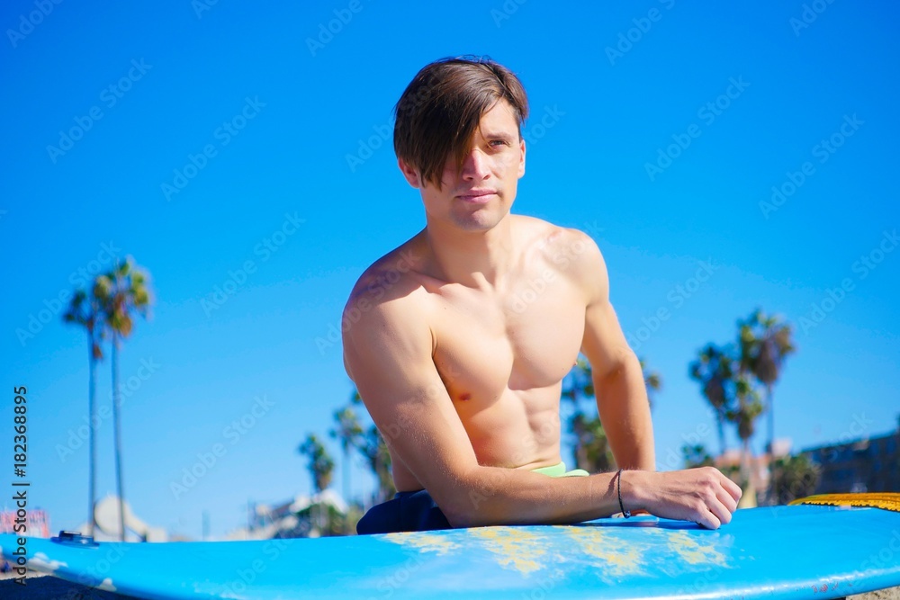 Sunny day, bright colors. Handsome model with pretty face and perfect skin. Action adventure, relax at the beach.