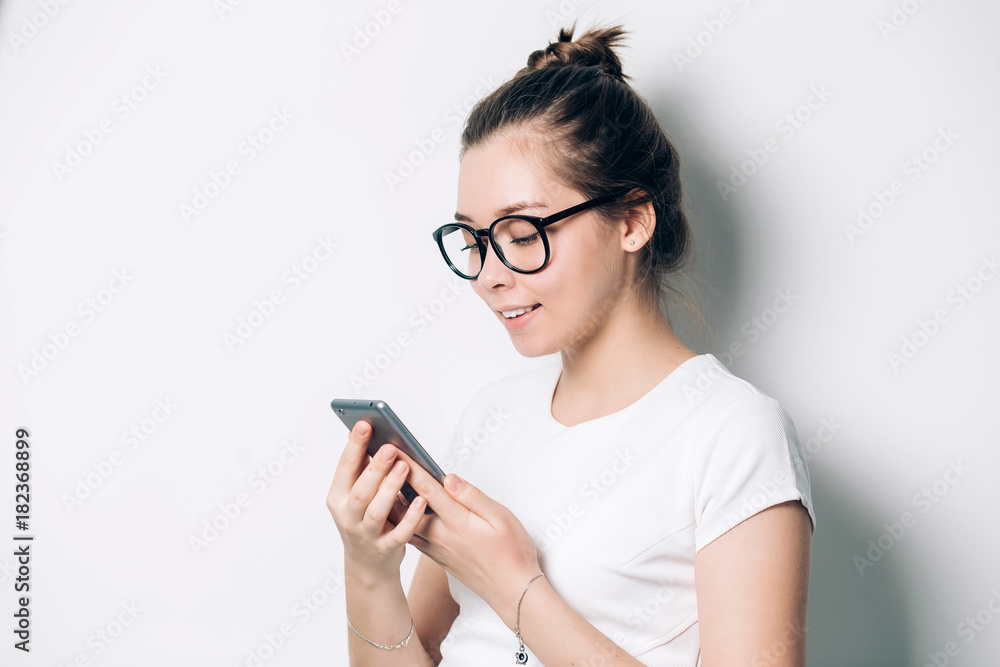 Image of young female using cellular phone Image of young female using cellular phone