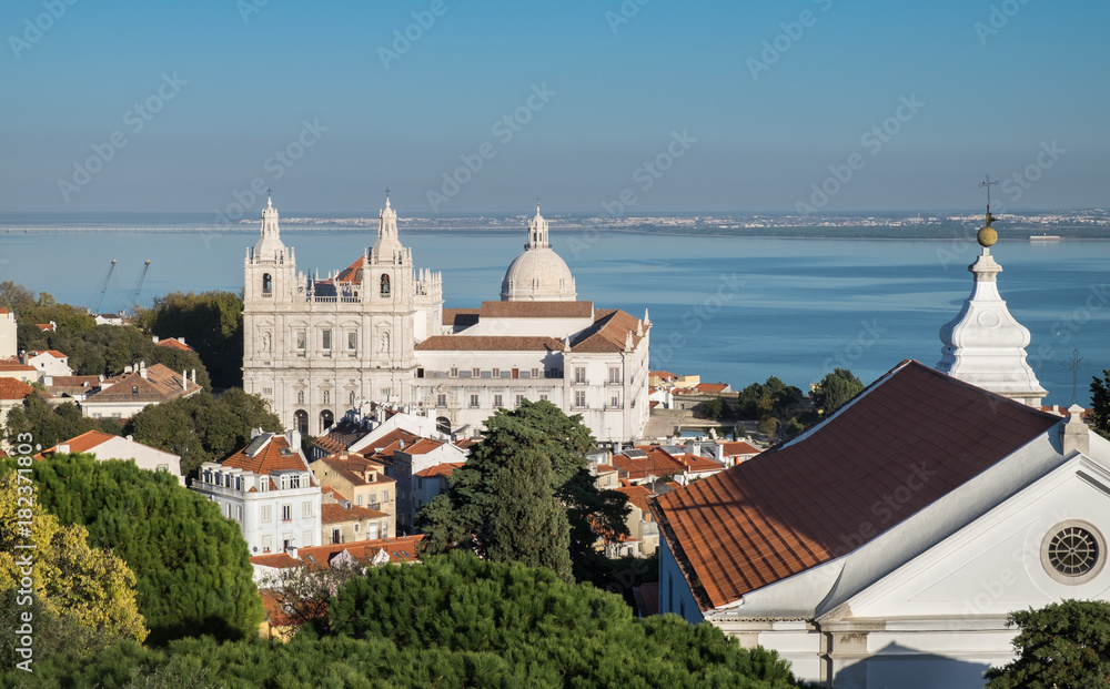 View on Sao Vicente de Fora church and red roofs on Lisbon centre. Portugal