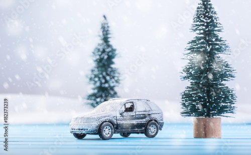 Miniature toy car with a Christmas tree