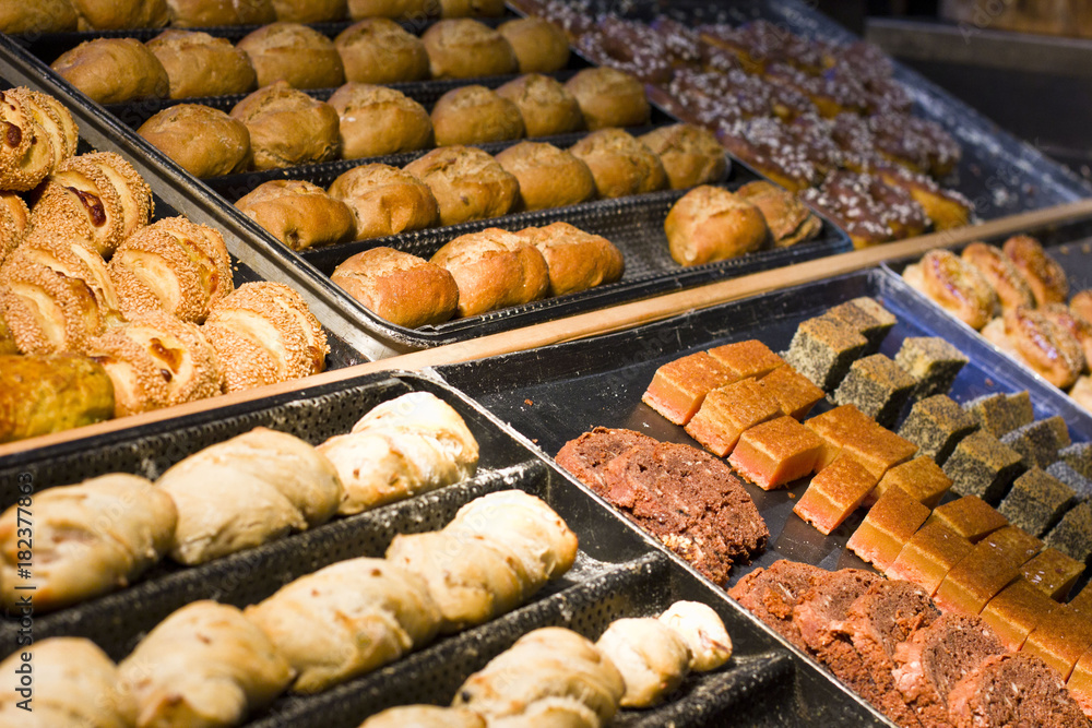 A variety of baked goods. Buns from puff pastry with raisins, cakes.
