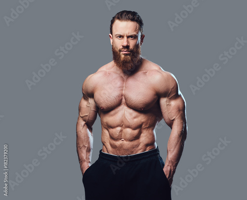 Portrait of bearded shirtless bodybuilder. photo
