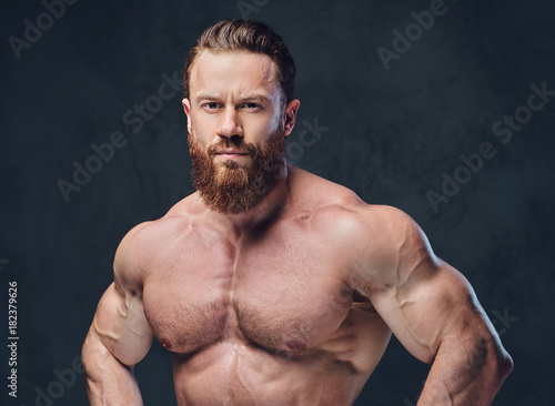 Portrait of bearded shirtless bodybuilder.