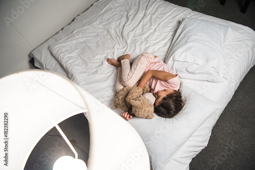 Fototapeta Naklejka Na Ścianę i Meble -  child sleeping in bed