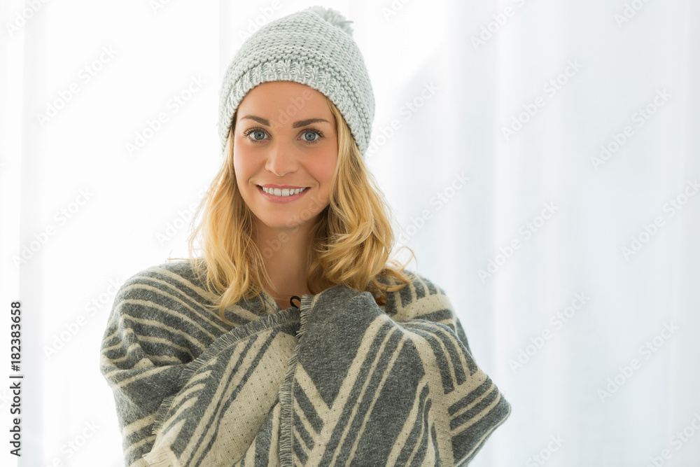 beautiful woman trying new wolly hat at home beautiful woman trying new wolly hat at home
