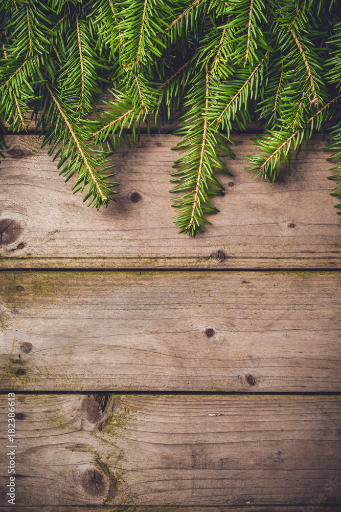 Christmas tree over an old wooden table Christmas tree over an old wooden table
