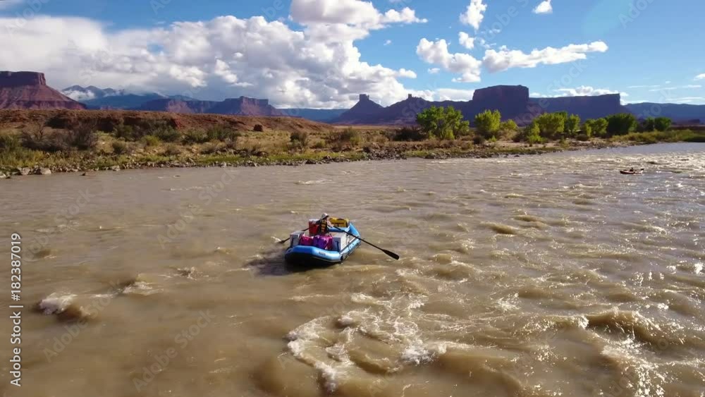 Aerial of people float down the colorado river in the dry desert Aerial of people float down the colorado river in the dry desert