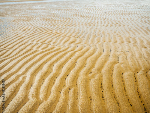 Natural Pattern Made By Sea Waves In The Sand. Abstract background photo
