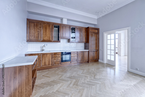 The kitchen is solid wood in a classic style in a modern house.