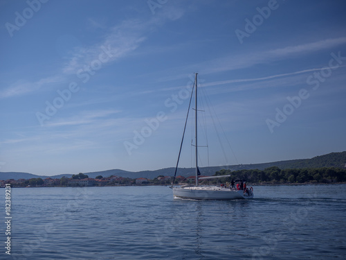 CROATIA, ADRIATIC SEA, 2017.11.07: Sailing boat in front of islands.