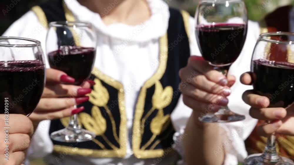 People are toasting with wine glasses People are toasting with wine glasses