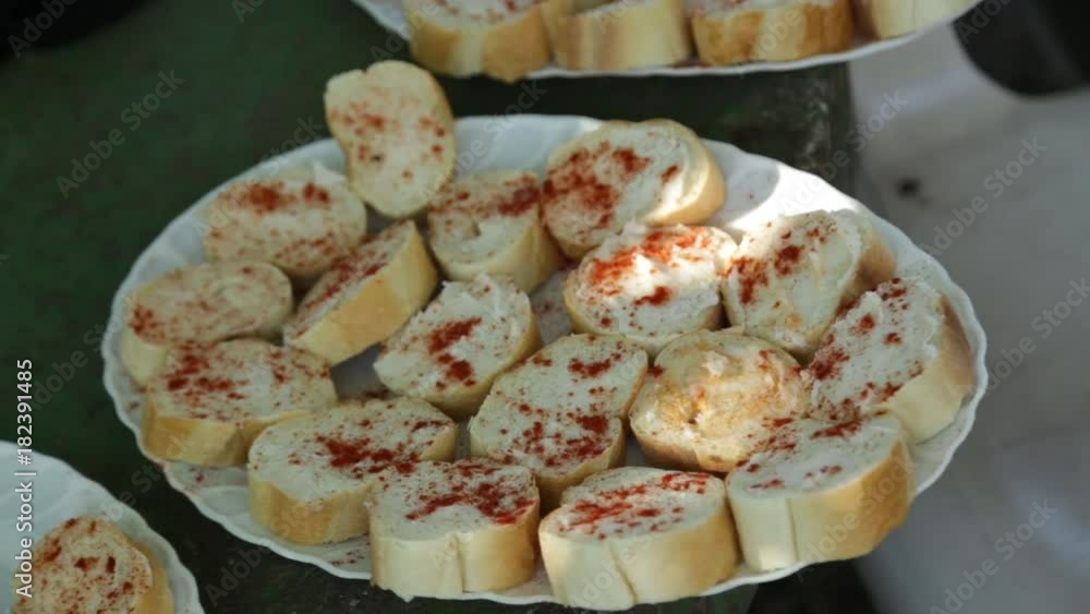 Slices of bread spread with lard, rural cuisine Slices of bread spread with lard, rural cuisine