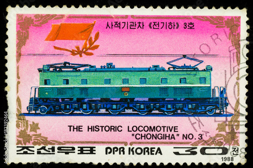 Samara, Russia - November 25, 2017: Old postage stamp printed in DPR Korea, shows historic locomotive chongiha and railroad photo