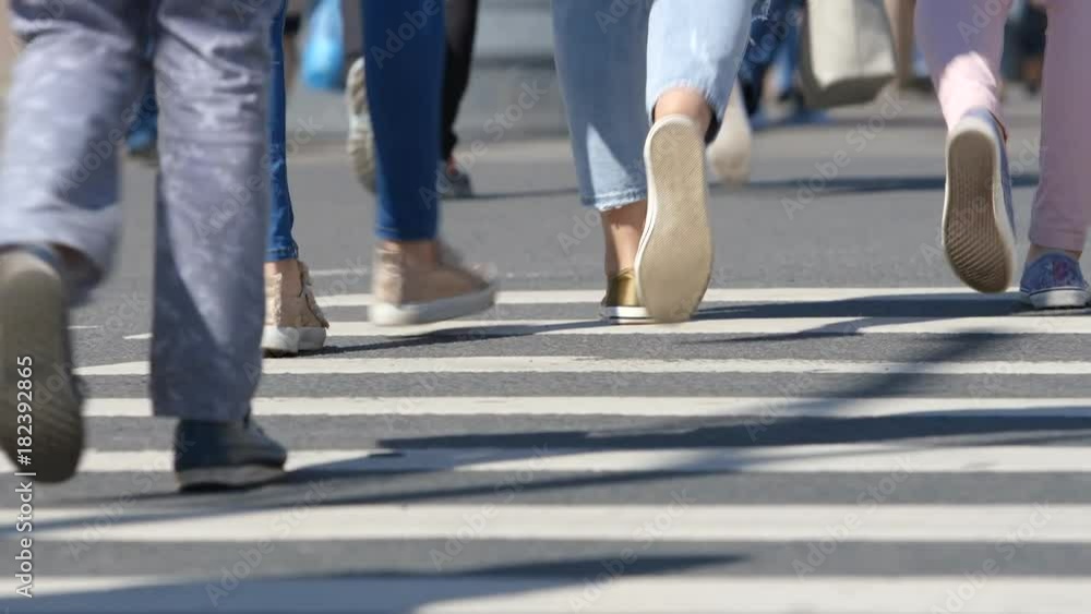 Legs of people walking on a crosswalk - St. Petersburg, Russia Legs of people walking on a crosswalk - St. Petersburg, Russia