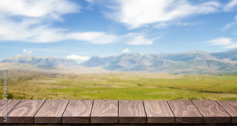 Fototapeta premium Empty wooden table with beautiful landscape background