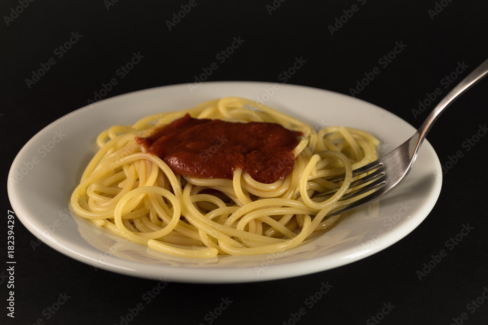 Italian spaghetti with tomato sauce with fork Italian spaghetti with tomato sauce with fork