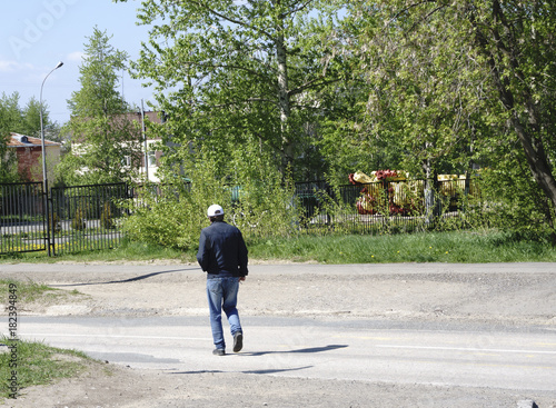 Mature Man Crossing Road photo