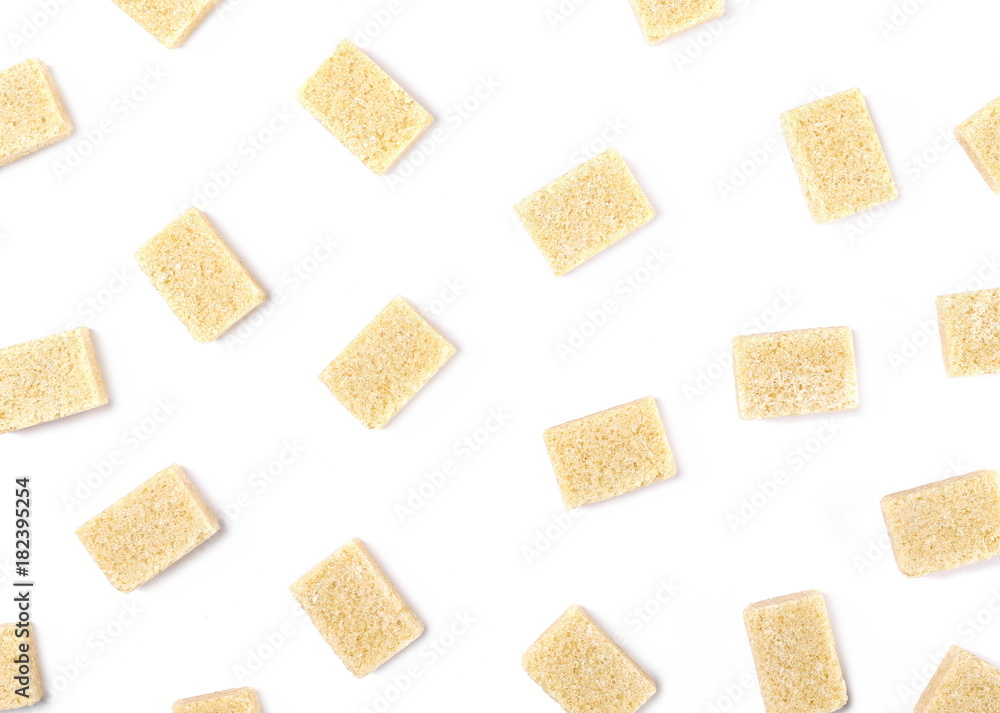 Brown cane sugar cubes isolated on white background, top view Brown cane sugar cubes isolated on white background, top view