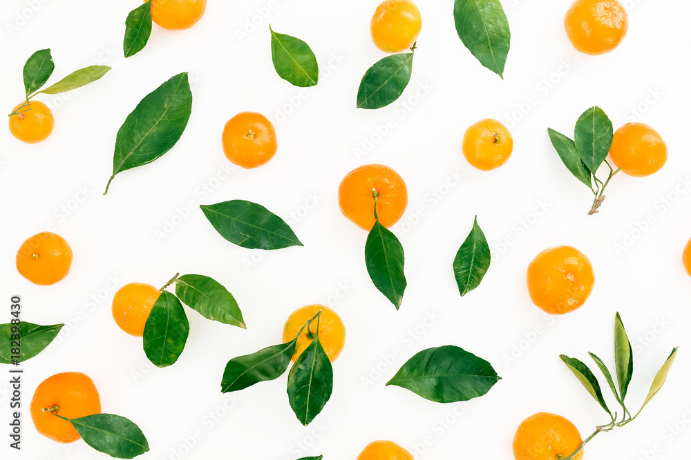 Pattern of fresh citrus with leaves on white background. Flat lay. Top view Pattern of fresh citrus with leaves on white background. Flat lay. Top view