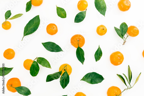 Pattern of fresh citrus with leaves on white background. Flat lay. Top view