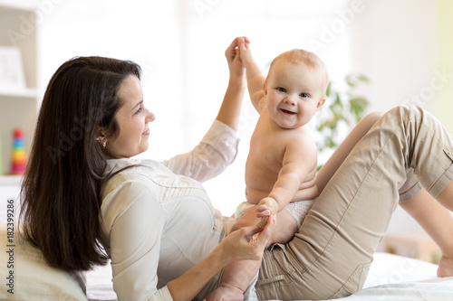 Mom and baby boy in diaper ...